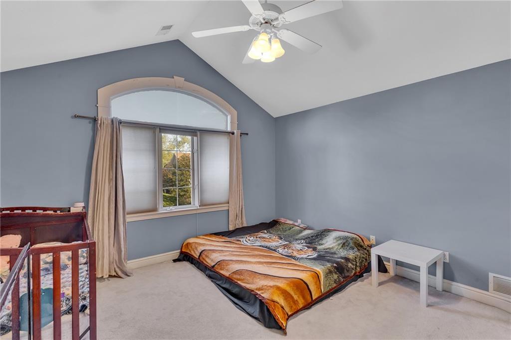 5010 Prides Court Murrysville, PA 15668 - Photo 28 of 49 a bedroom with a bed and a chandelier