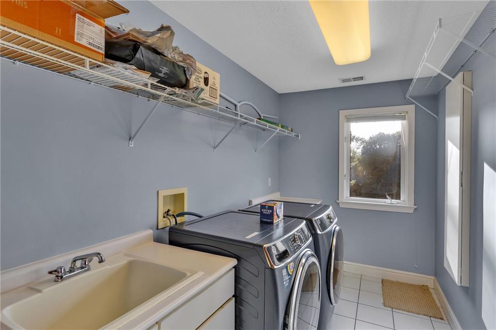 5010 Prides Court Murrysville, PA 15668 - Photo 29 of 49 a utility room with dryer and washer