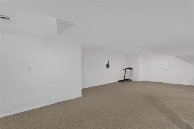 a view of a room with a projector and a window