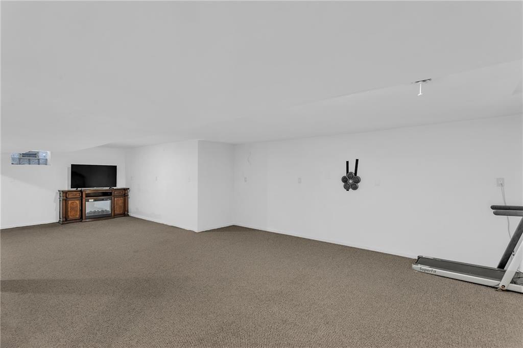 5010 Prides Court Murrysville, PA 15668 - Photo 36 of 49 a view of a room with a projector and a window