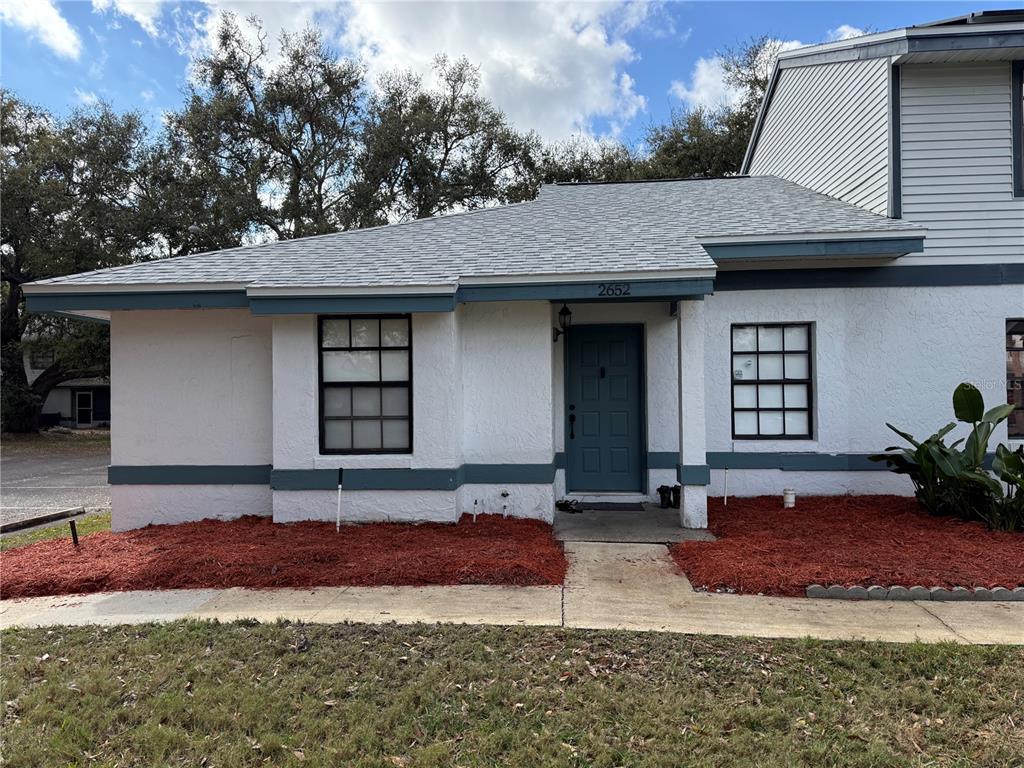 2652 Graduate Court Orlando, FL 32826 - Photo 1 of 1 a front view of a house with a yard and a garage