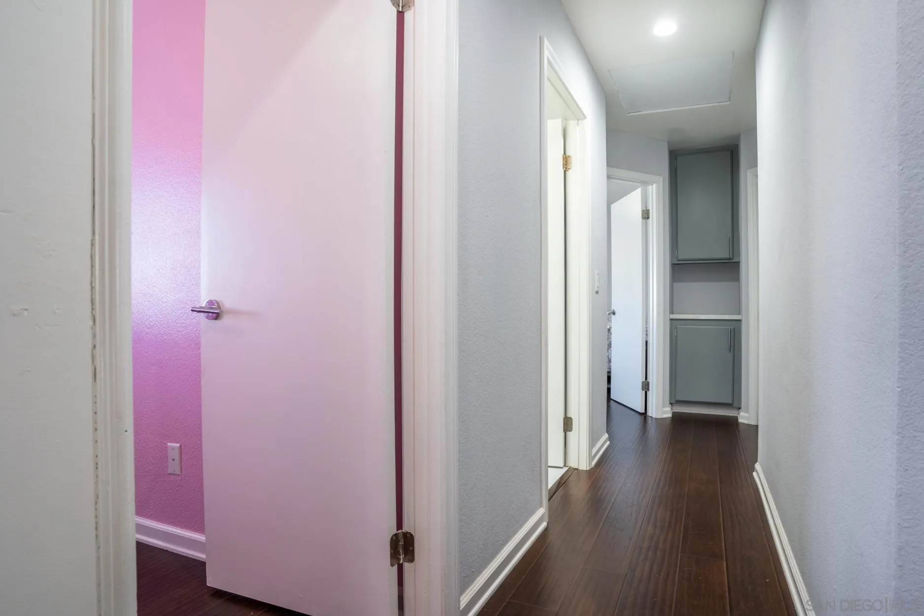 4857 Northerly Street Oceanside, CA 92056 - Photo 19 of 32 a view of a hallway with wooden floor
