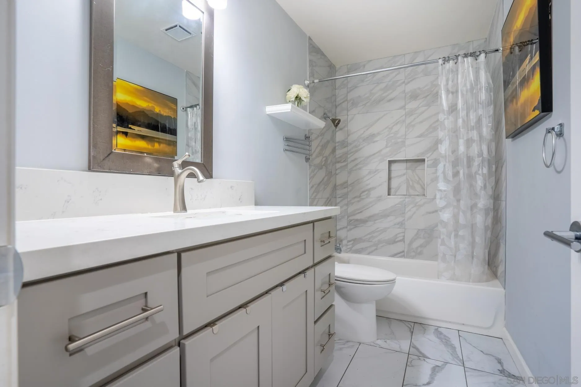 4857 Northerly Street Oceanside, CA 92056 - Photo 20 of 32 a bathroom with a sink a toilet and shower