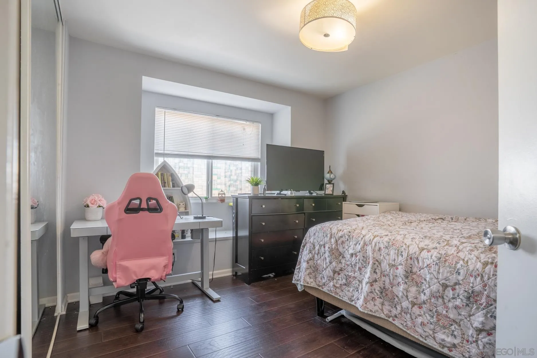 4857 Northerly Street Oceanside, CA 92056 - Photo 21 of 32 a bedroom with a bed and a window