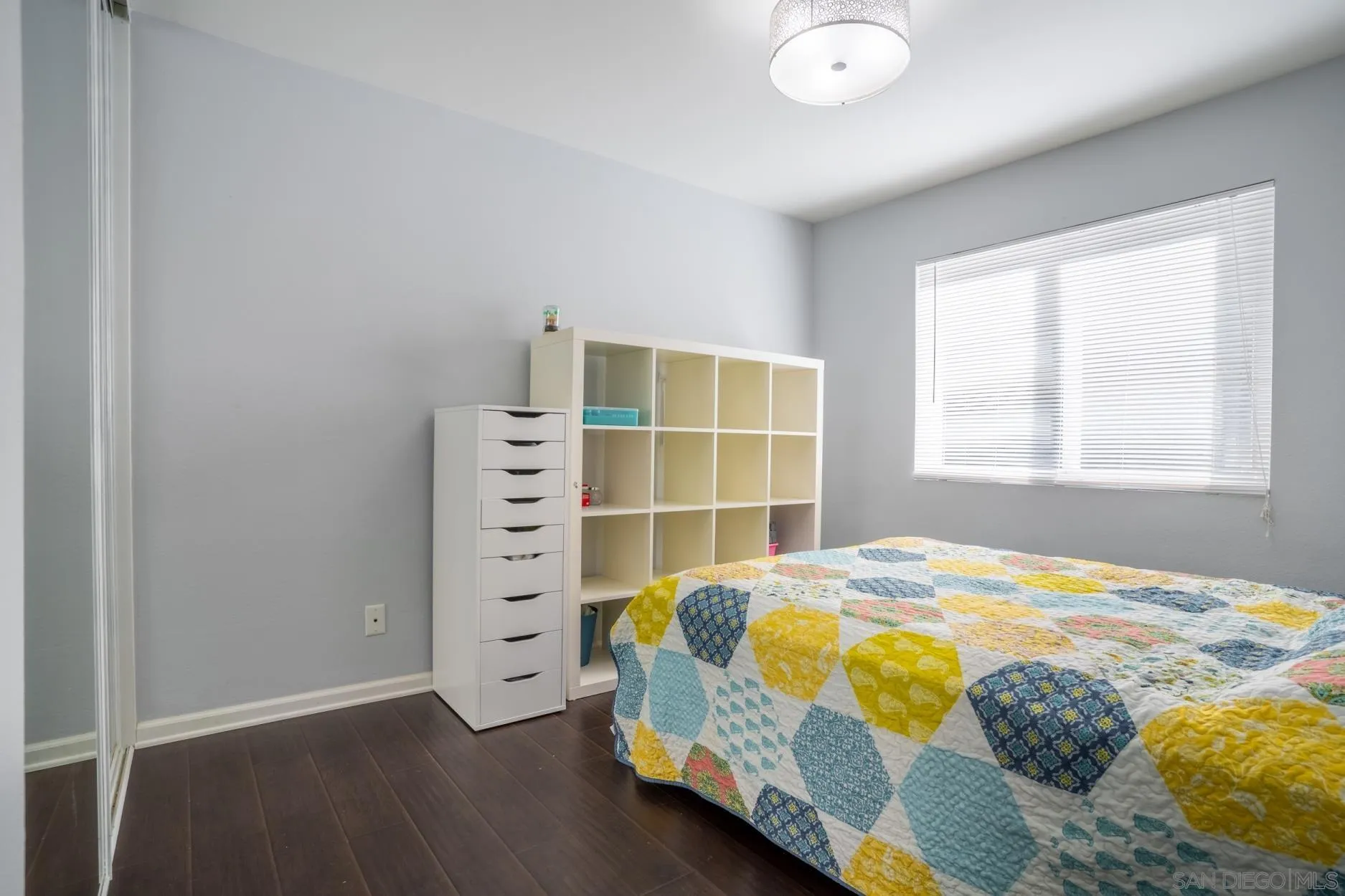 4857 Northerly Street Oceanside, CA 92056 - Photo 22 of 32 a bedroom with a bed and a window