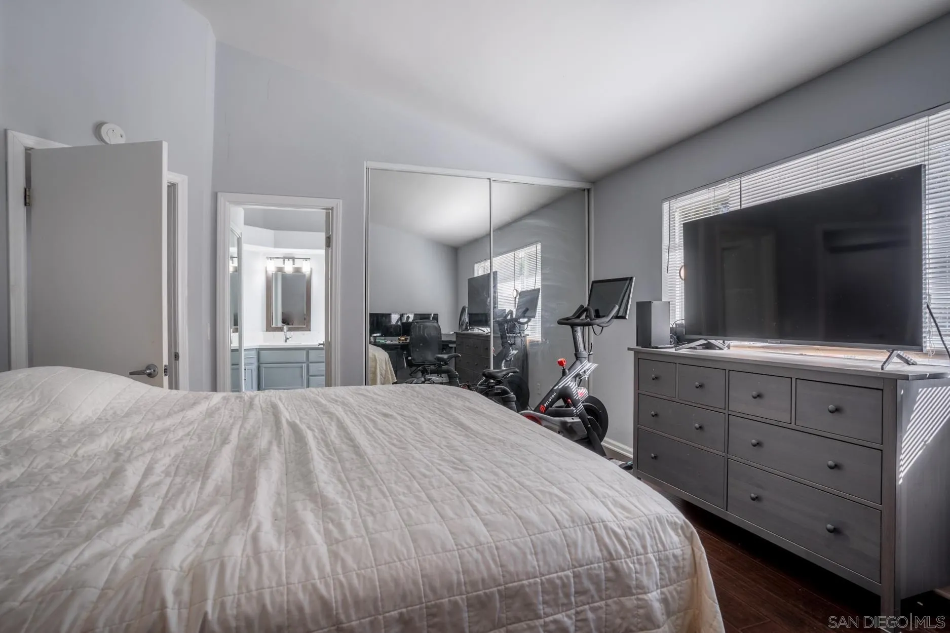 4857 Northerly Street Oceanside, CA 92056 - Photo 23 of 32 a bedroom with a bed and a flat screen tv