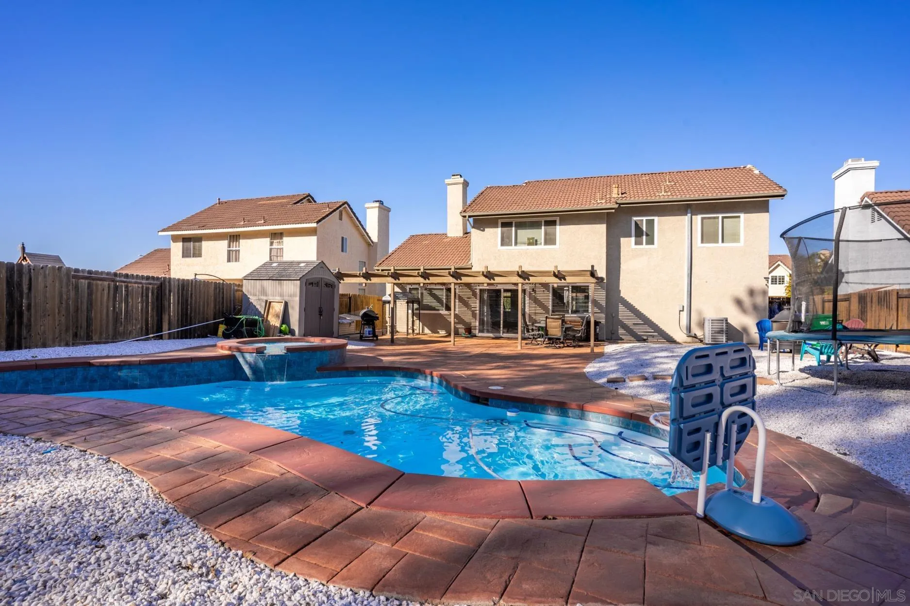 4857 Northerly Street Oceanside, CA 92056 - Photo 32 of 32 a view of a house with swimming pool and sitting area
