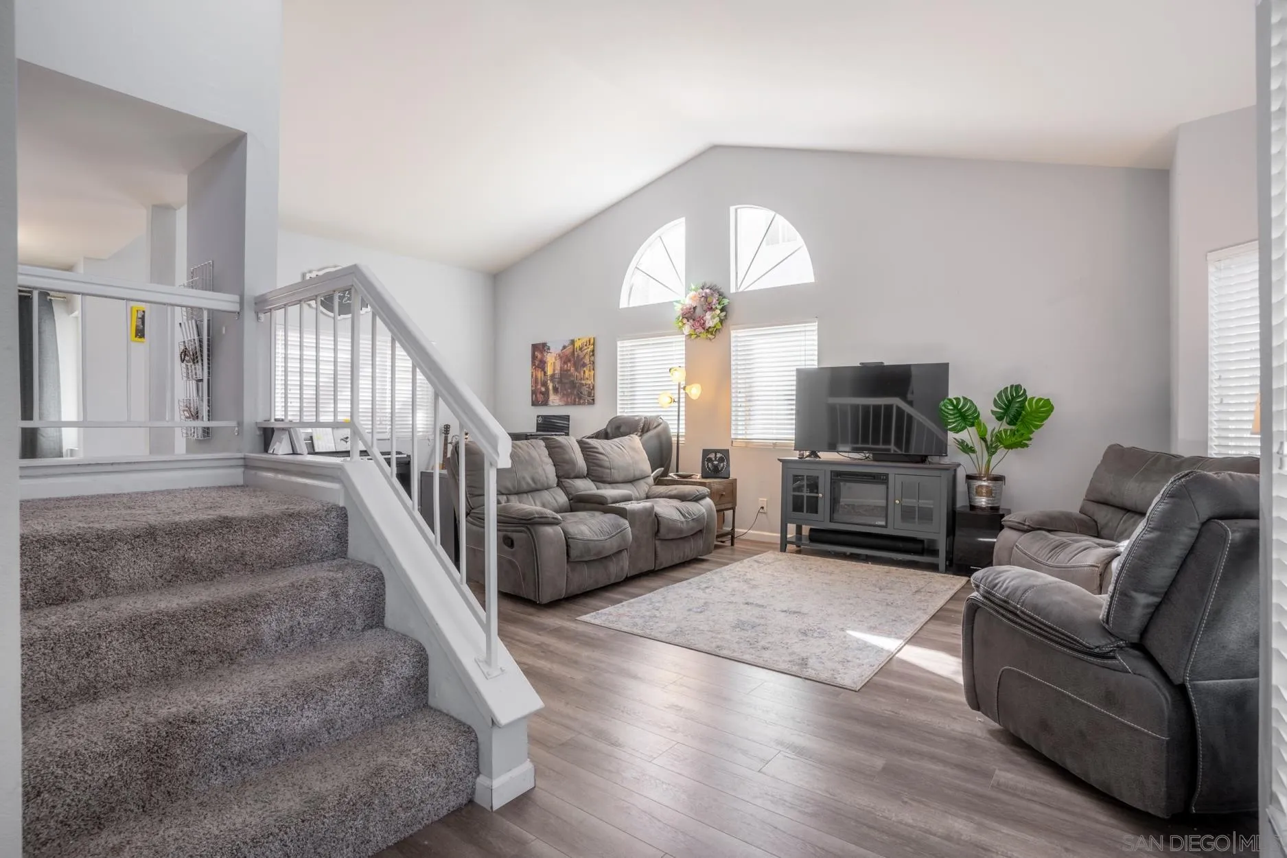 4857 Northerly Street Oceanside, CA 92056 - Photo 5 of 32 a living room with furniture and a large window