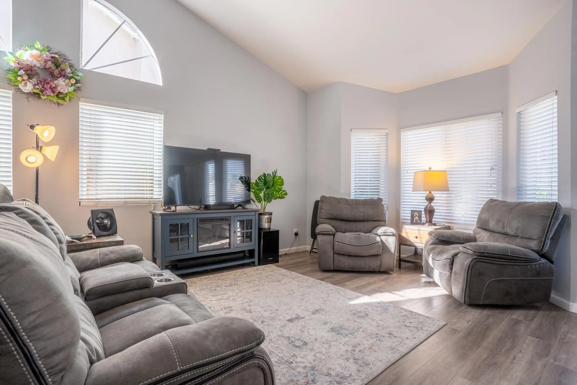 4857 Northerly Street Oceanside, CA 92056 - Photo 7 of 32 a living room with furniture and a flat screen tv