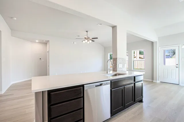 a view with cabinets and wooden floor