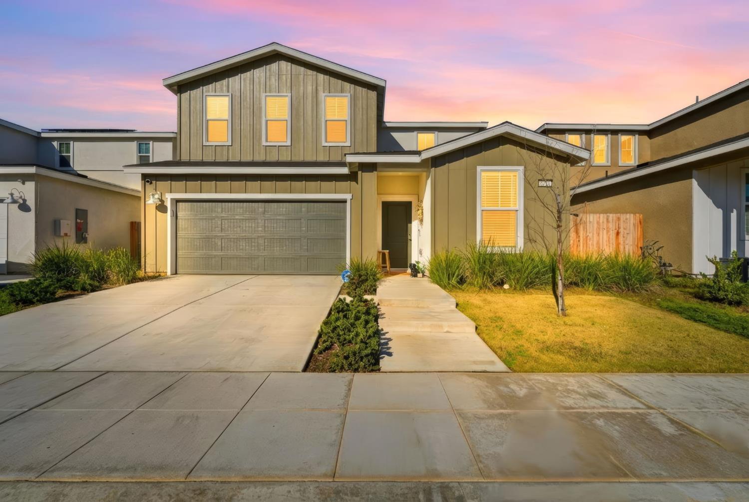a front view of a house with yard