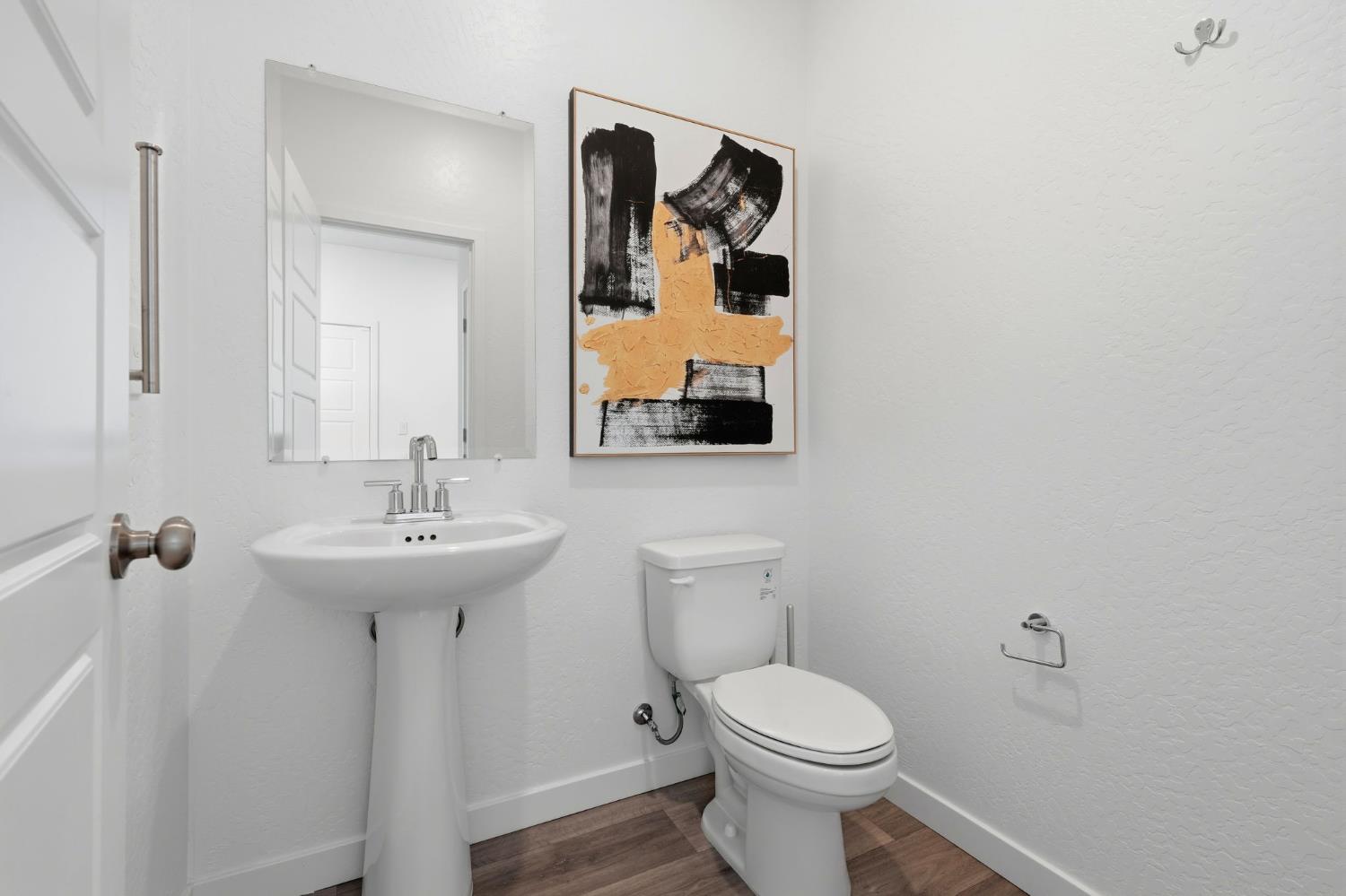 4225 Hampton Way Clovis, CA 93619 - Photo 17 of 64 a bathroom with a toilet sink and mirror