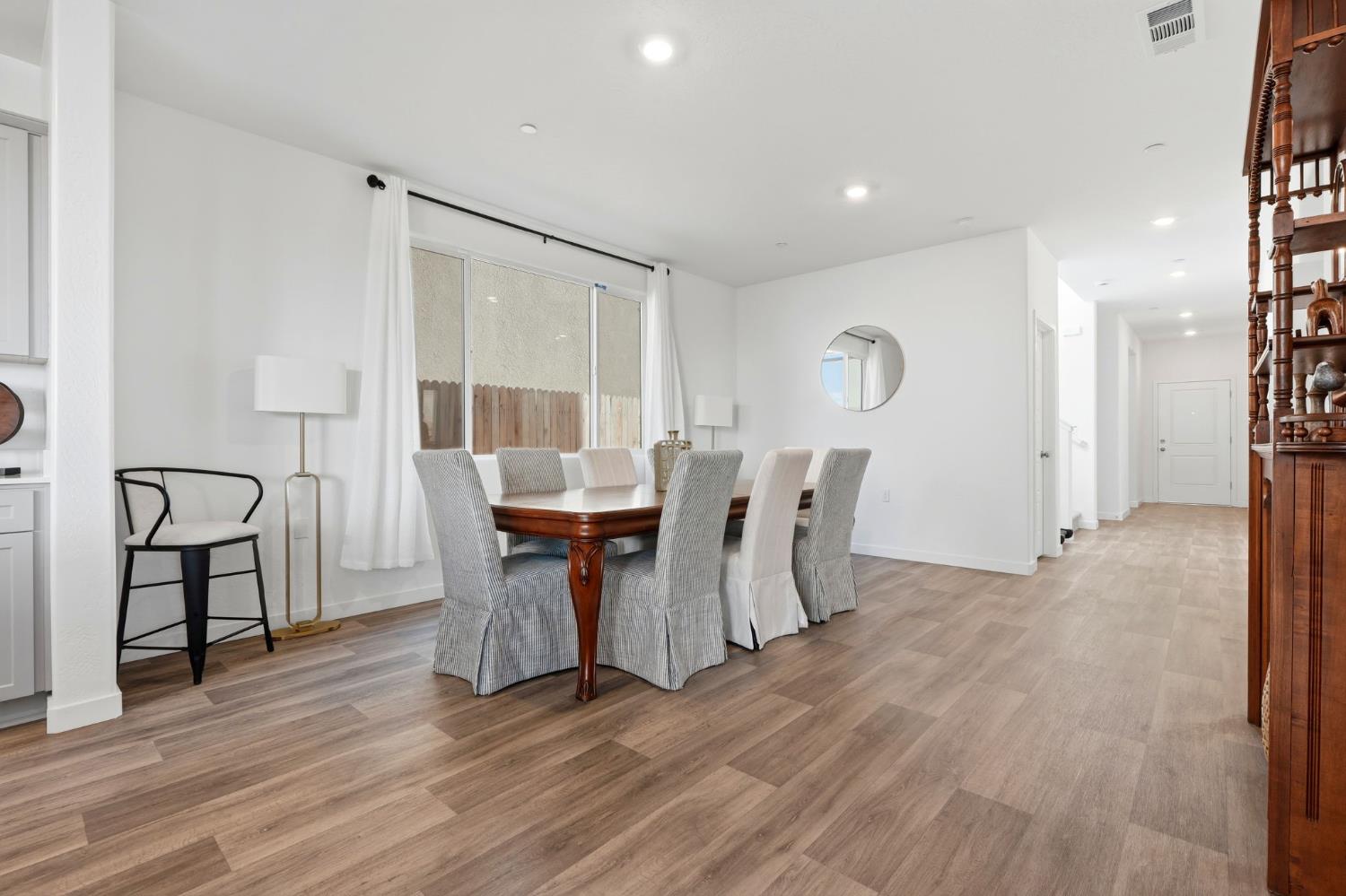 4225 Hampton Way Clovis, CA 93619 - Photo 20 of 64 a view of a dining room with furniture and wooden floor