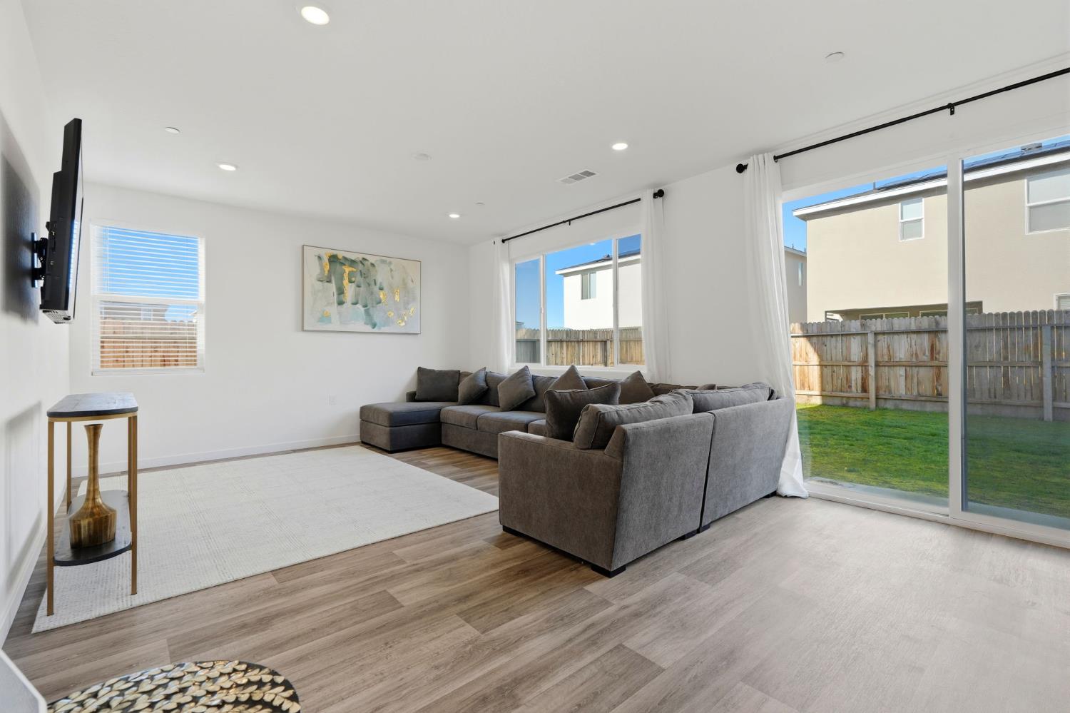 4225 Hampton Way Clovis, CA 93619 - Photo 26 of 64 a living room with furniture and a floor to ceiling window