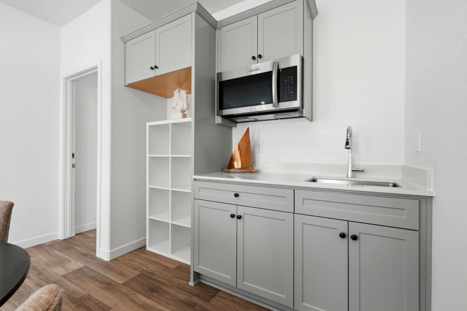 4225 Hampton Way Clovis, CA 93619 - Photo 33 of 64 a kitchen with stainless steel appliances a sink and cabinets