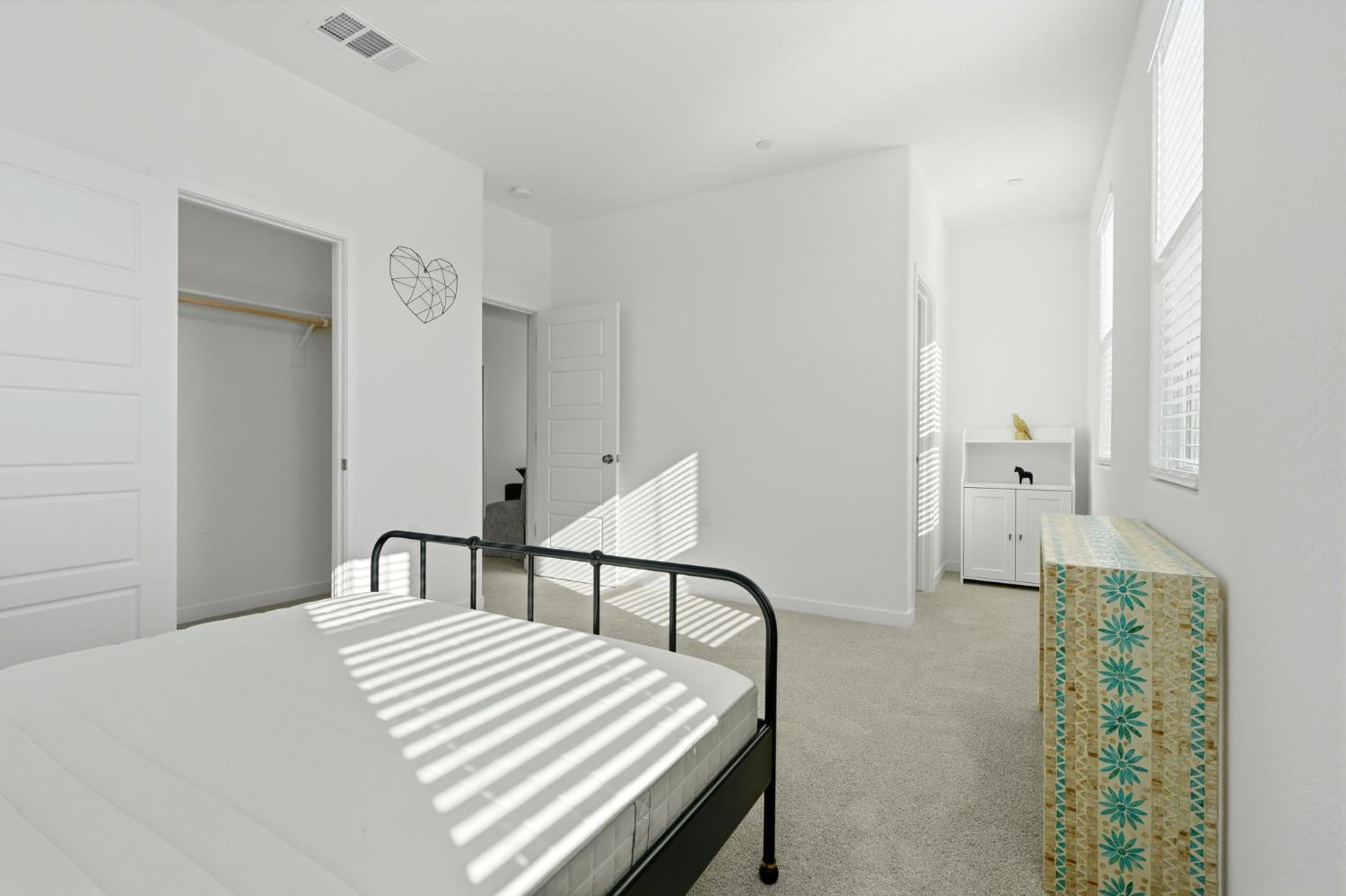 4225 Hampton Way Clovis, CA 93619 - Photo 42 of 64 a bedroom with a bed and a chair