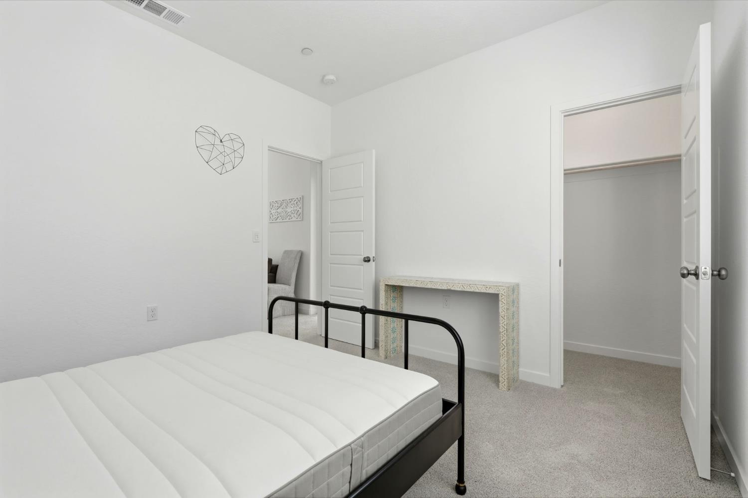 4225 Hampton Way Clovis, CA 93619 - Photo 45 of 64 a bedroom with a bed and a table