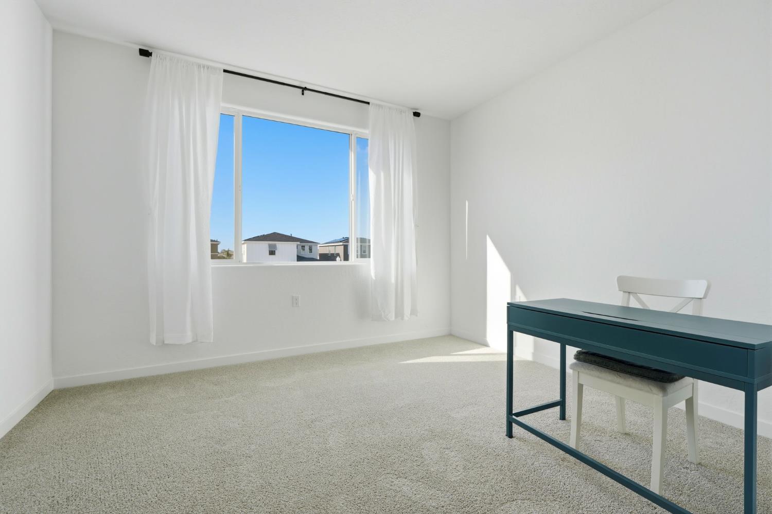 4225 Hampton Way Clovis, CA 93619 - Photo 53 of 64 a view of a room that has a bed and a table in it