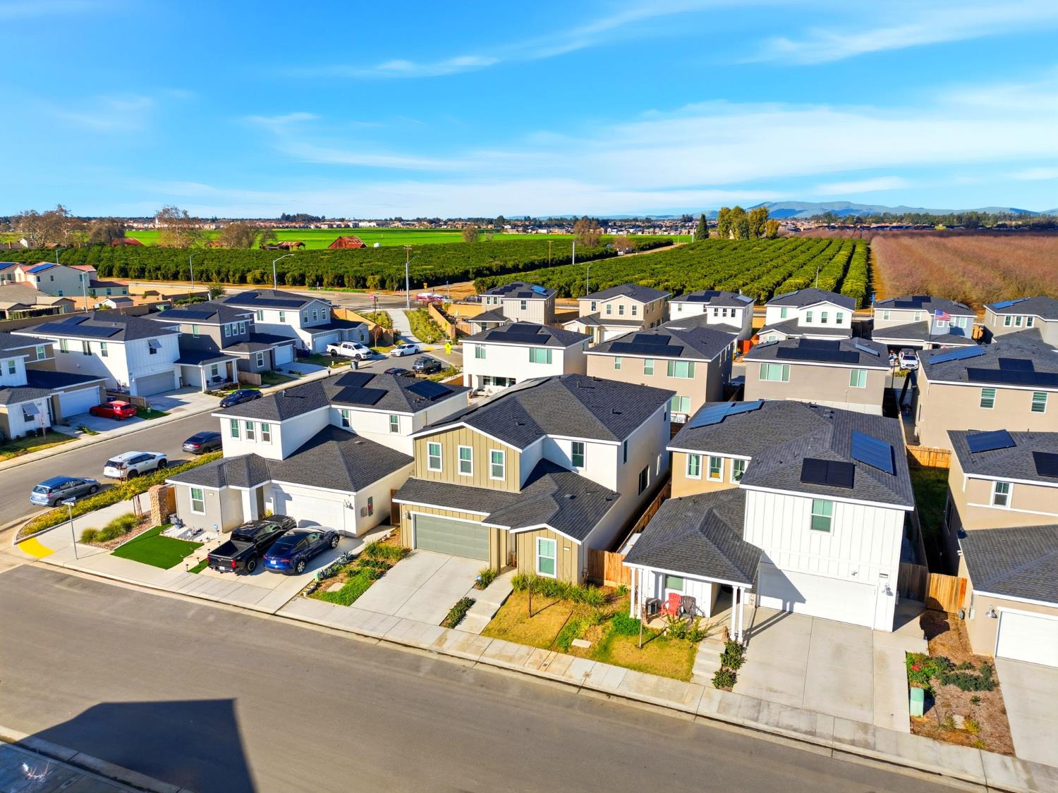 4225 Hampton Way Clovis, CA 93619 - Photo 8 of 64 an aerial view of residential houses with outdoor space and ocean view