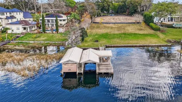 an aerial view of a house with a garden and plants