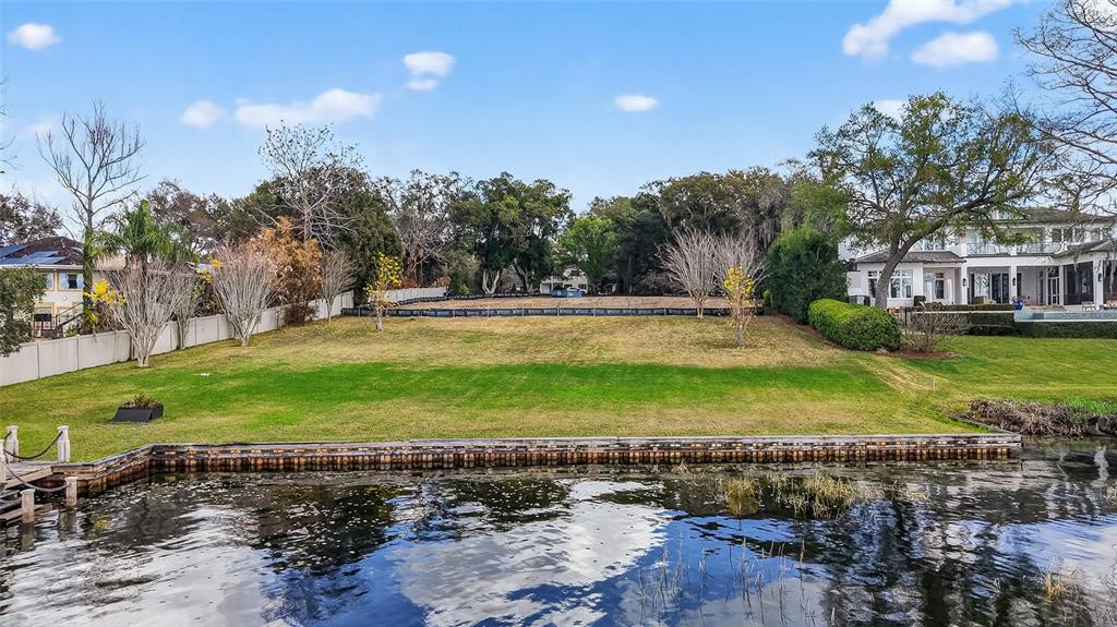 2624 Midsummer Drive Windermere, FL 34786 - Photo 19 of 22 a view of a yard with a table and chairs