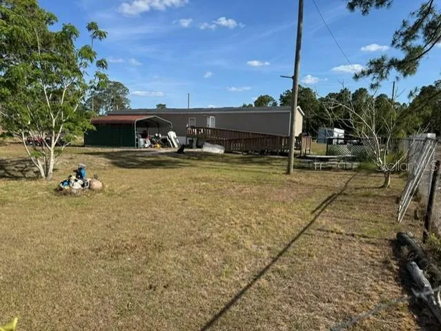 a view of a yard with an outdoor space