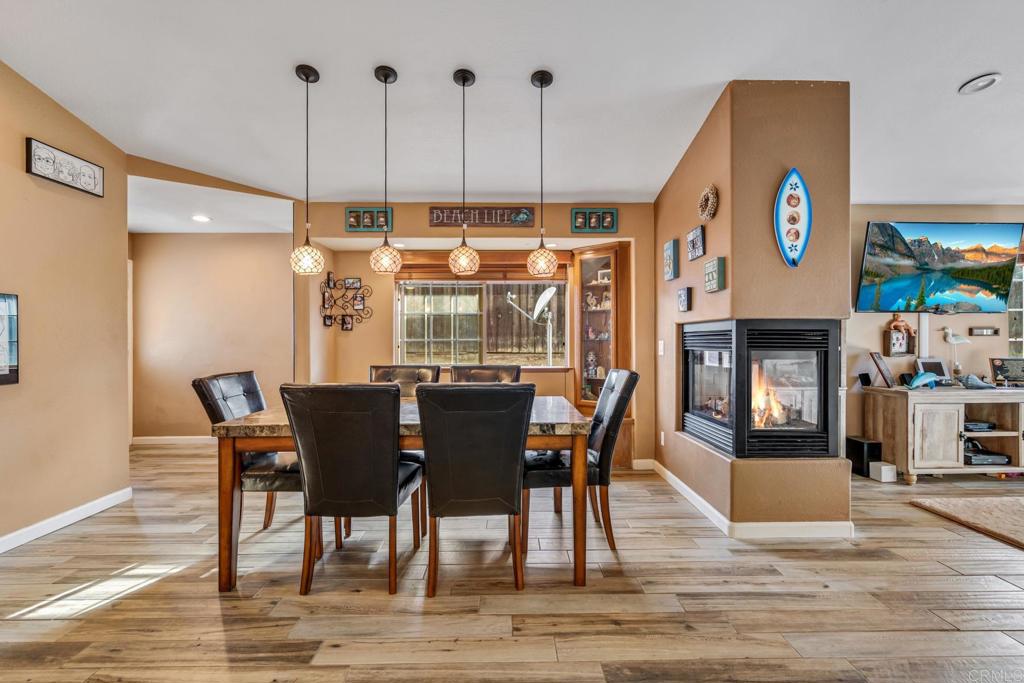 13492 Lori Place El Cajon, CA 92021 - Photo 1 of 1 a view of a dining room with furniture wooden floor and a floor to ceiling window