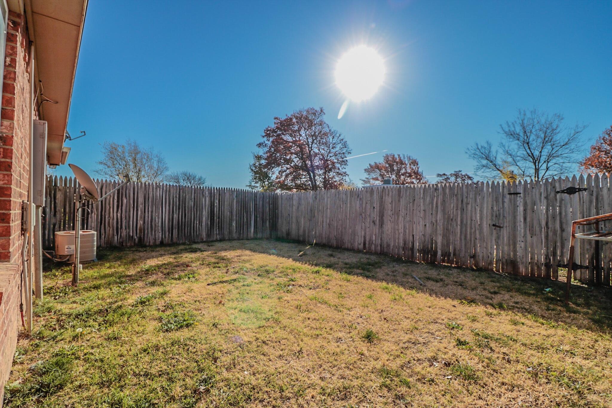 2409 87th Street, Unit B Lubbock, TX 79423 - Photo 11 of 11 a view of outdoor space with wooden fence