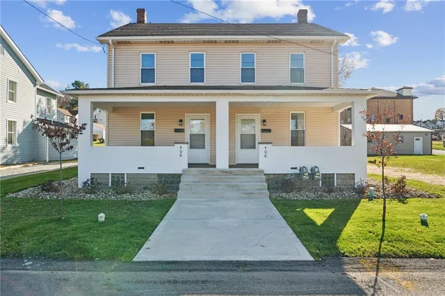 front view of a house with a yard