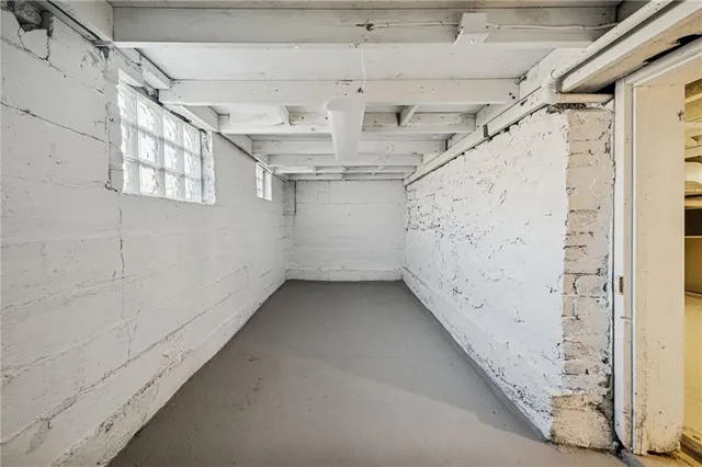 a view of empty room with stairs and ventilation