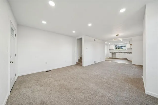 a kitchen with stainless steel appliances granite countertop a sink and cabinets