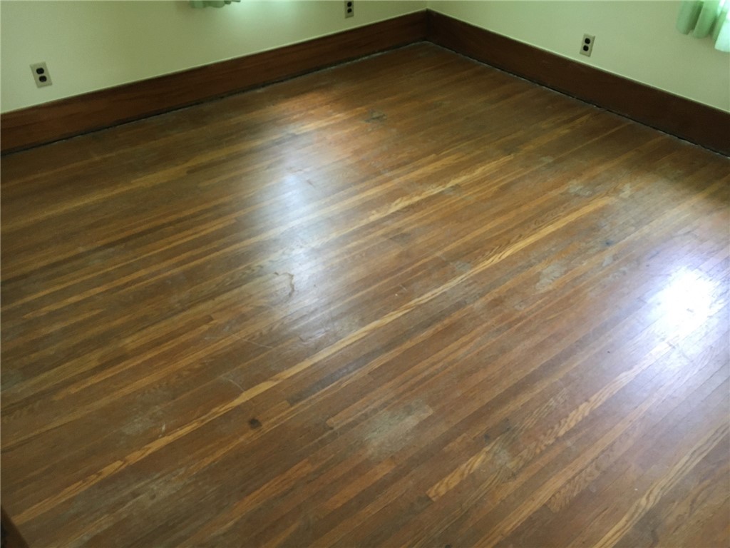 27 Dorset Street Rochester, NY 14609 - Photo 12 of 17 Bedroom 1 Hardwood Floor Underneath Carpet