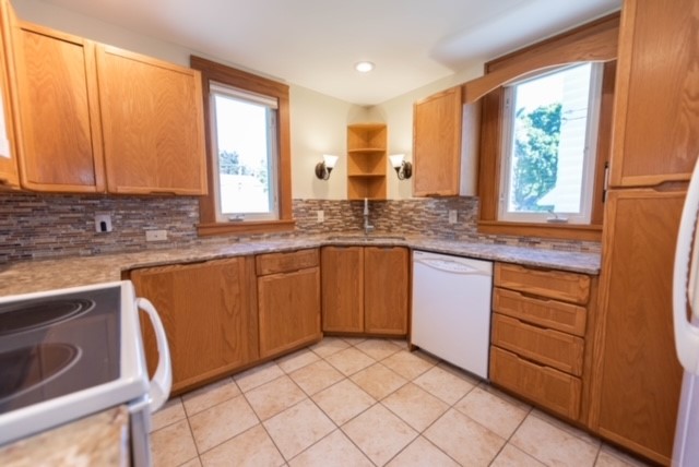 27 Dorset Street Rochester, NY 14609 - Photo 7 of 17 Kitchen With Tile Backsplash, Granite Counter Tops