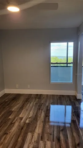 a bathroom with a granite countertop sink and a toilet