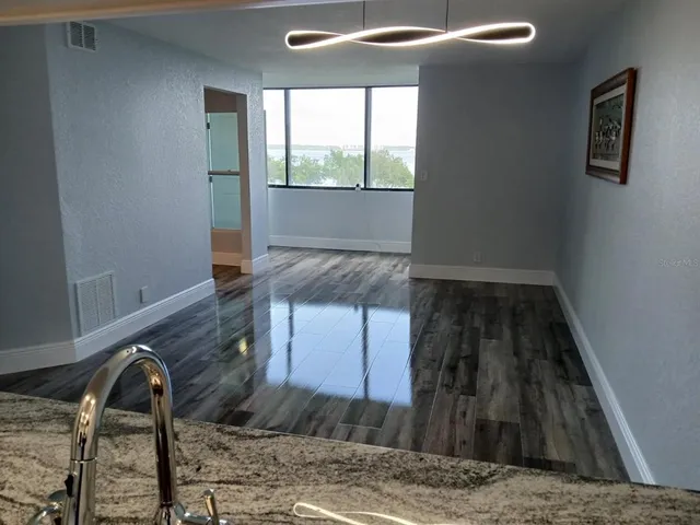 a stove top oven sitting inside of a kitchen