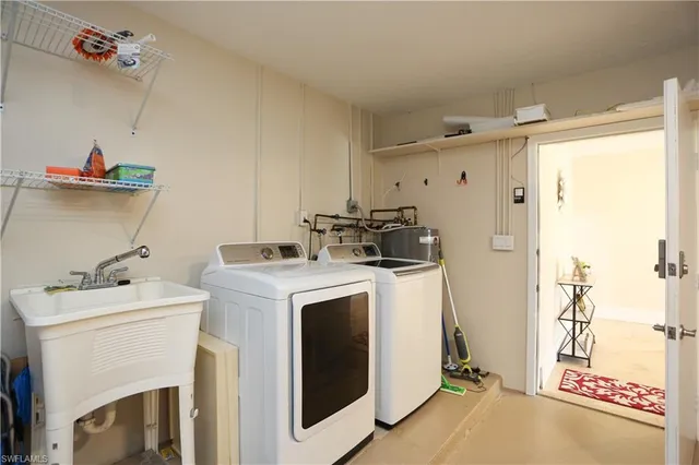 a view of storage and utility room with washer and dryer