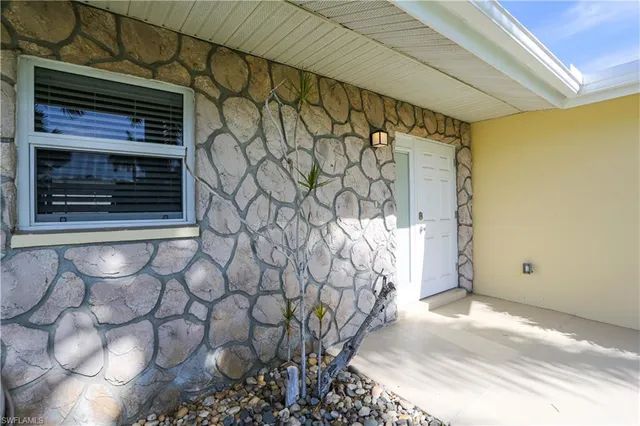 a bathroom with a shower and a sink