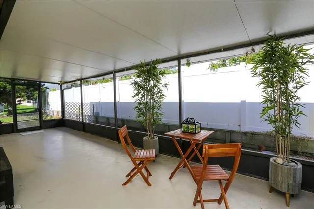 a outdoor space with a table and chairs