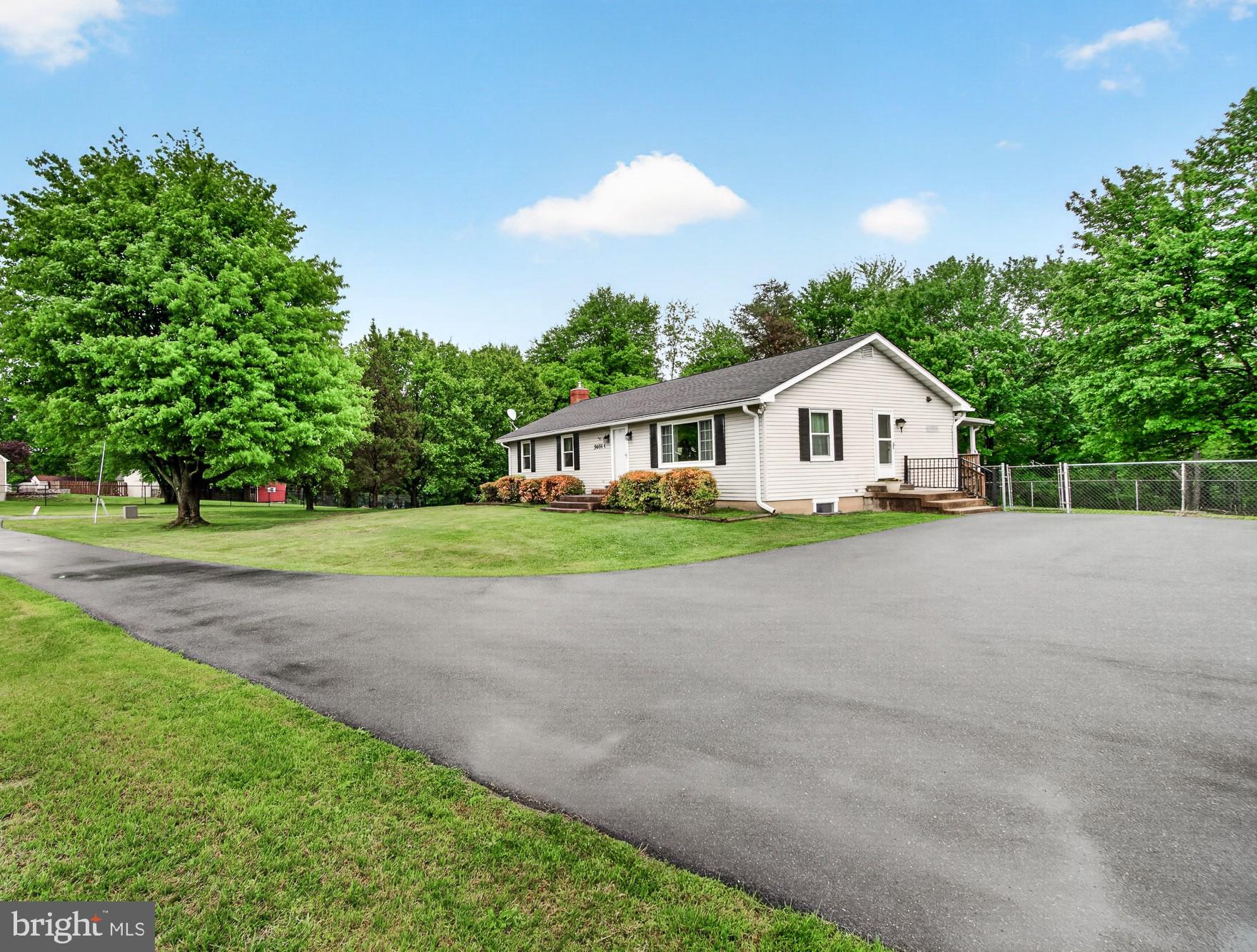 5601 Woodville Road Mount Airy, MD 21771 - Photo 8 of 54 a view of house with outdoor space and tree s