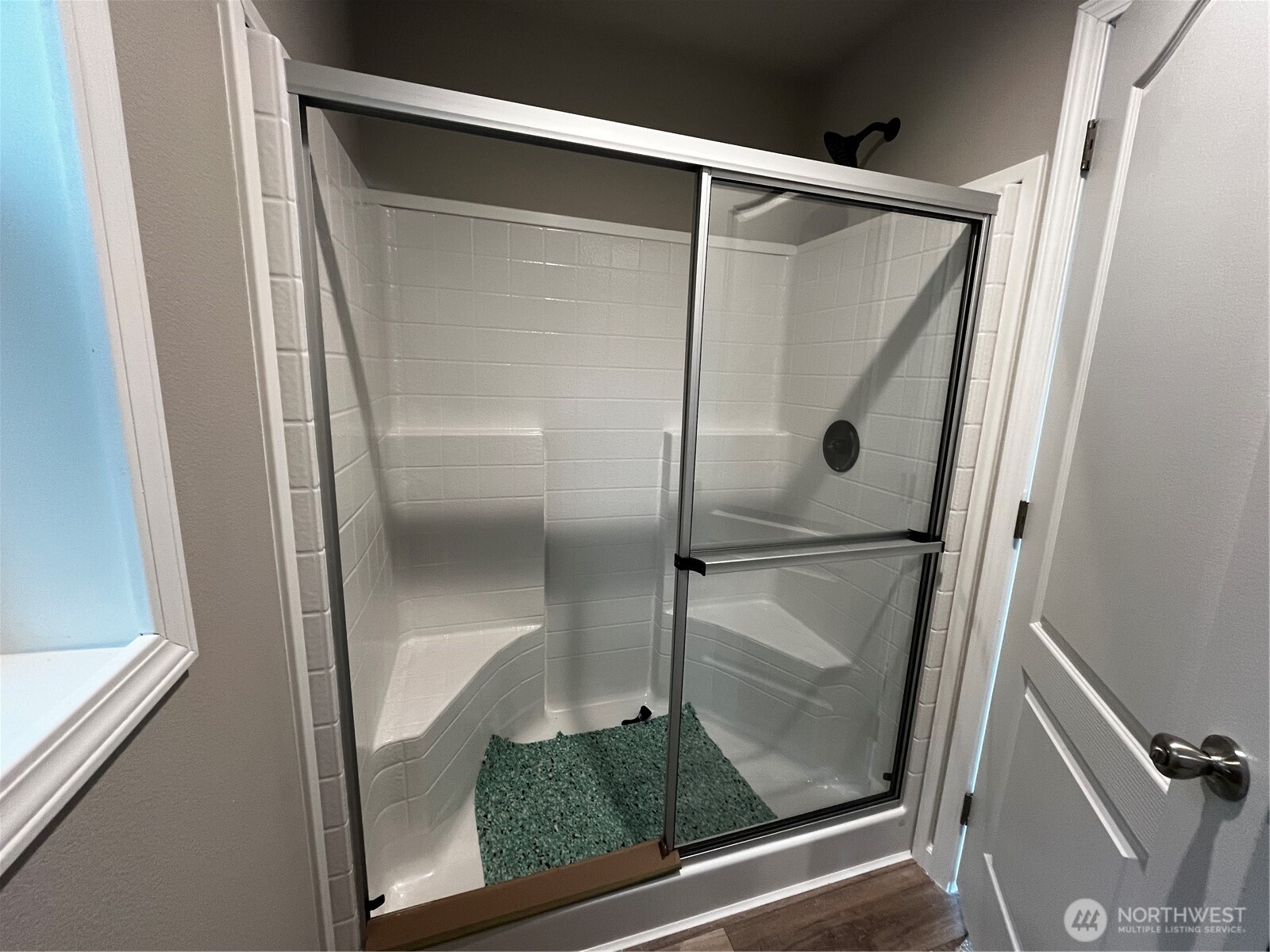 36 Porter Creek Road Elma, WA 98541 - Photo 14 of 16 a bathroom with a glass shower door