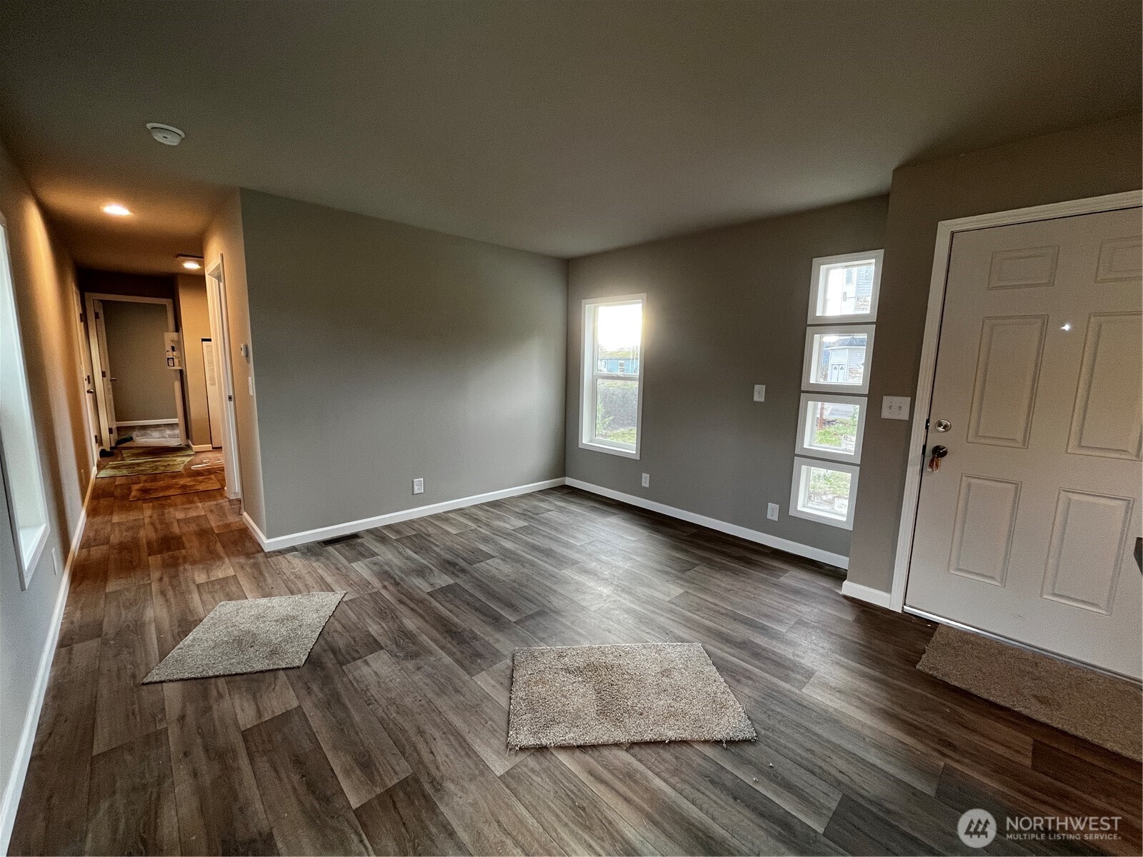36 Porter Creek Road Elma, WA 98541 - Photo 7 of 16 wooden floor in an empty room with a gallery