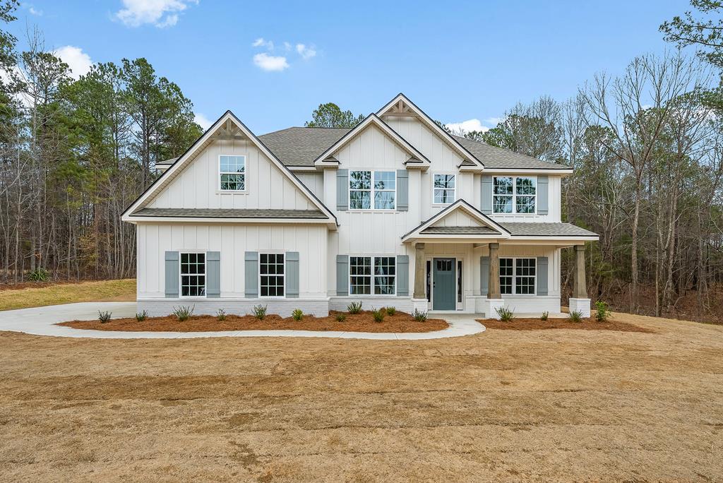 75 Oak Ridge Drive Waverly Hall, GA 31831 - Photo 1 of 40 a front view of a house with a yard