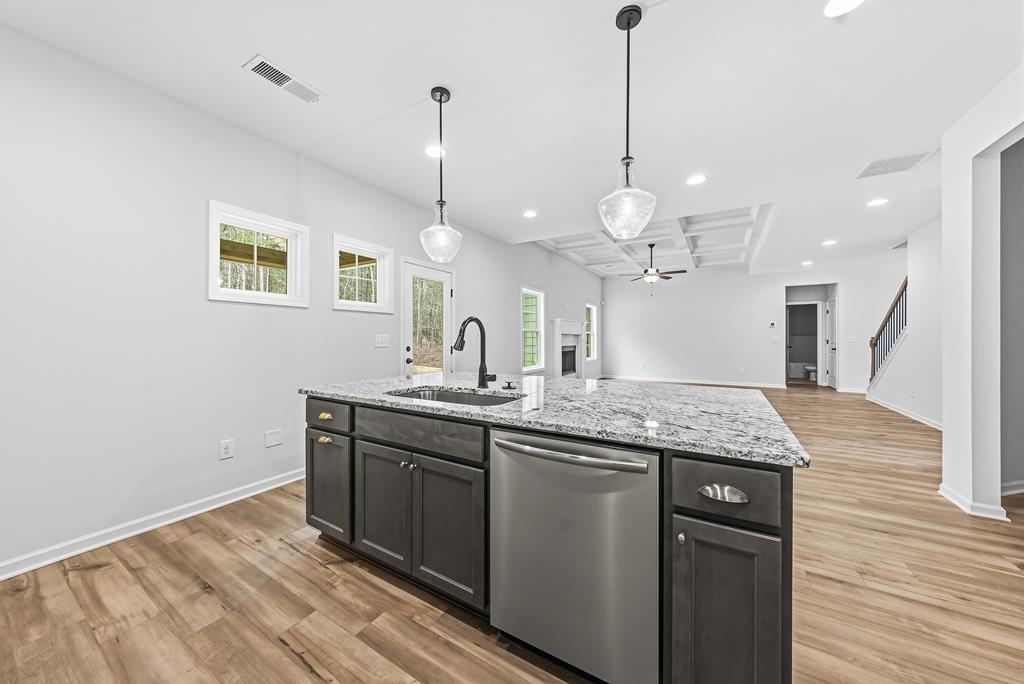 75 Oak Ridge Drive Waverly Hall, GA 31831 - Photo 17 of 40 a kitchen with a sink and chandelier