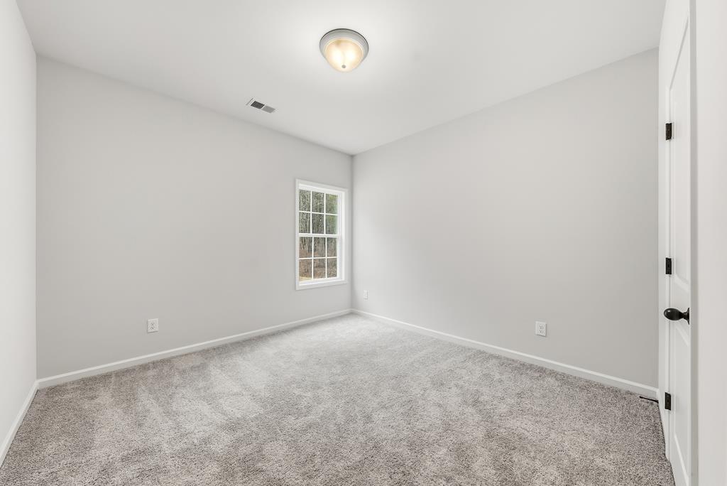 75 Oak Ridge Drive Waverly Hall, GA 31831 - Photo 18 of 40 an empty room with windows