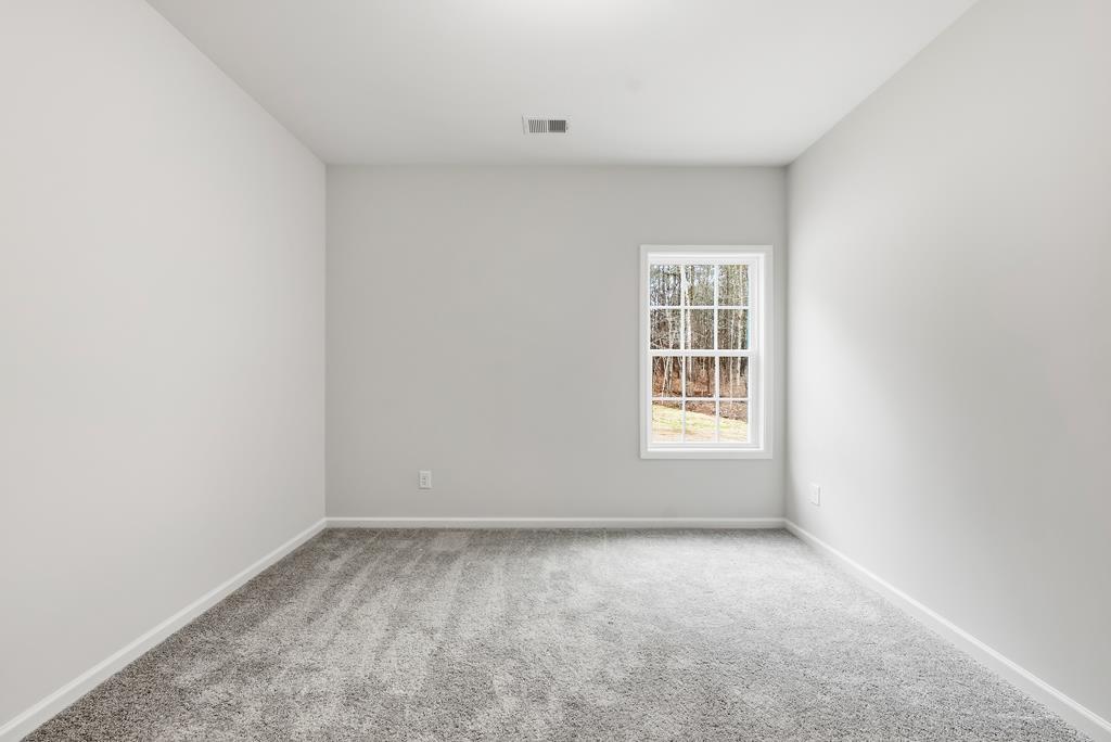 75 Oak Ridge Drive Waverly Hall, GA 31831 - Photo 19 of 40 an empty room with a window