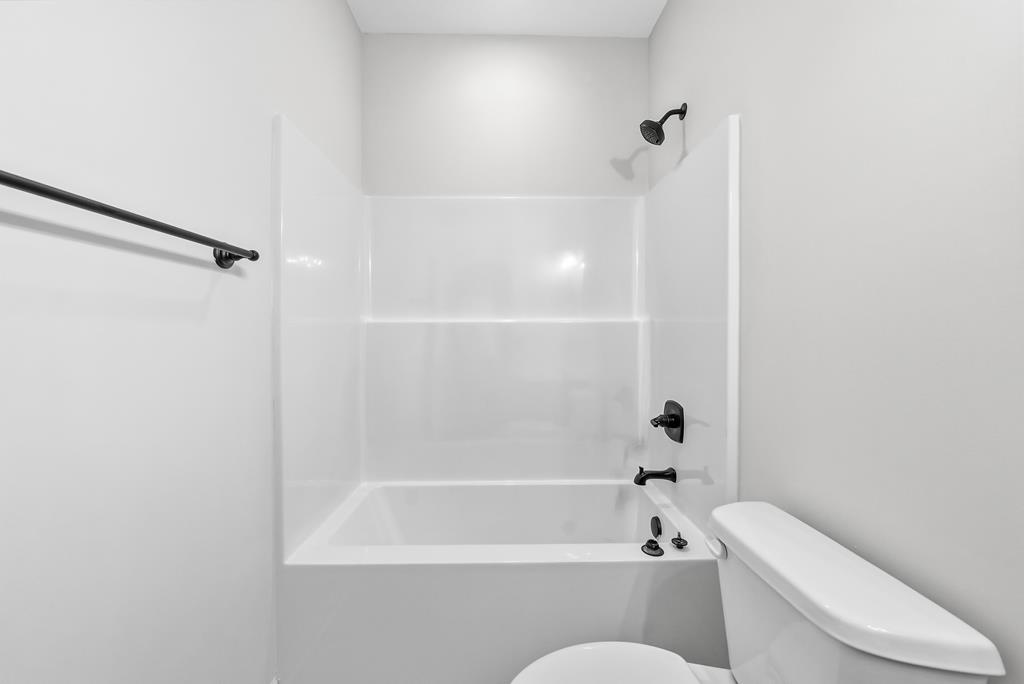 75 Oak Ridge Drive Waverly Hall, GA 31831 - Photo 21 of 40 a bathroom with a toilet and a bathtub