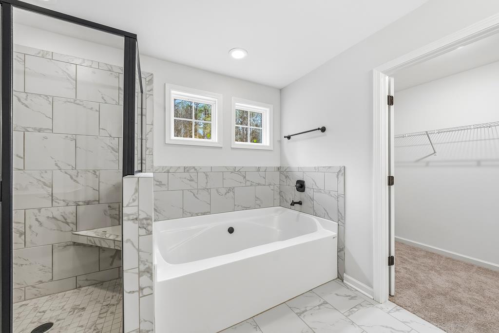 75 Oak Ridge Drive Waverly Hall, GA 31831 - Photo 25 of 40 a white bath tub sitting next to a shower