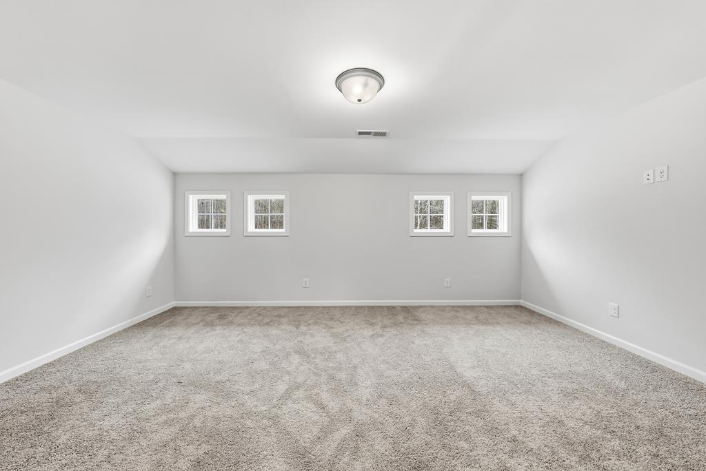 75 Oak Ridge Drive Waverly Hall, GA 31831 - Photo 29 of 40 an empty room with a empty space and windows