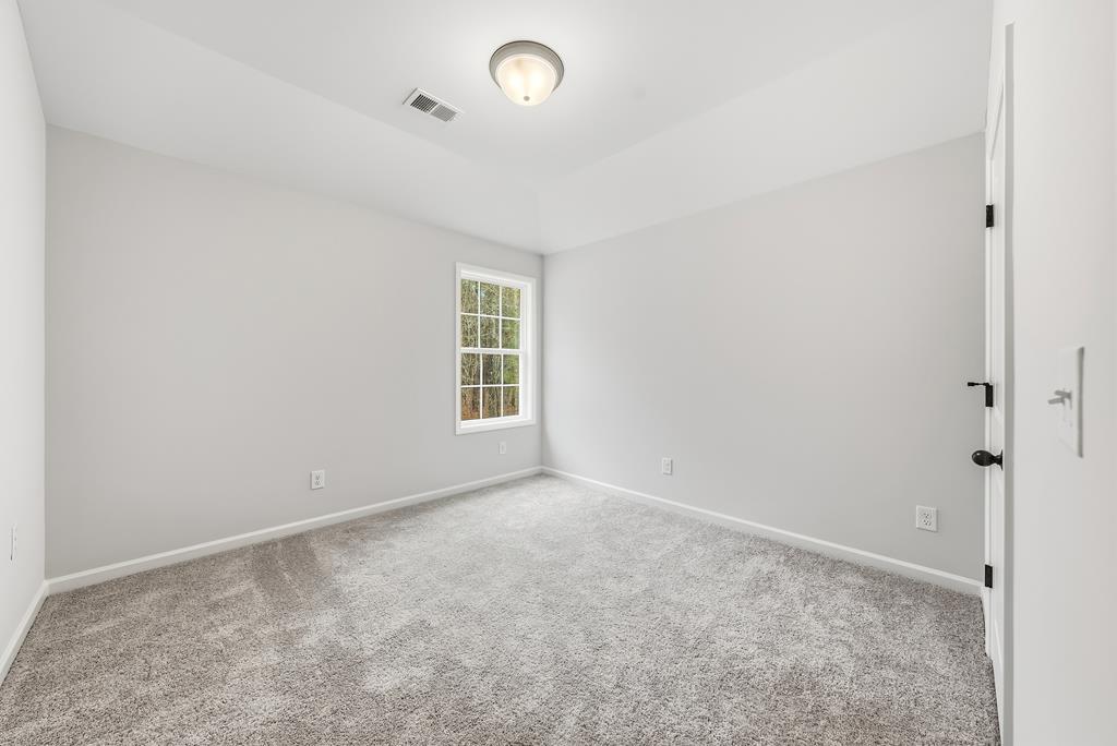 75 Oak Ridge Drive Waverly Hall, GA 31831 - Photo 32 of 40 an empty room with windows