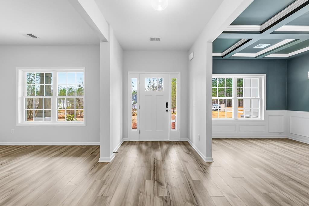 75 Oak Ridge Drive Waverly Hall, GA 31831 - Photo 5 of 40 an empty room with wooden floor and windows